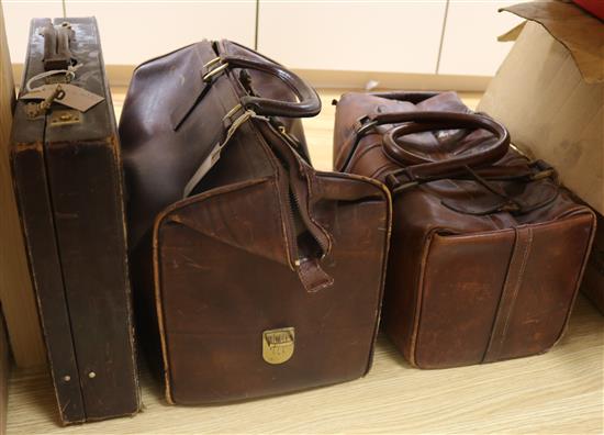 Two leather Gladstone bags and a suitcase